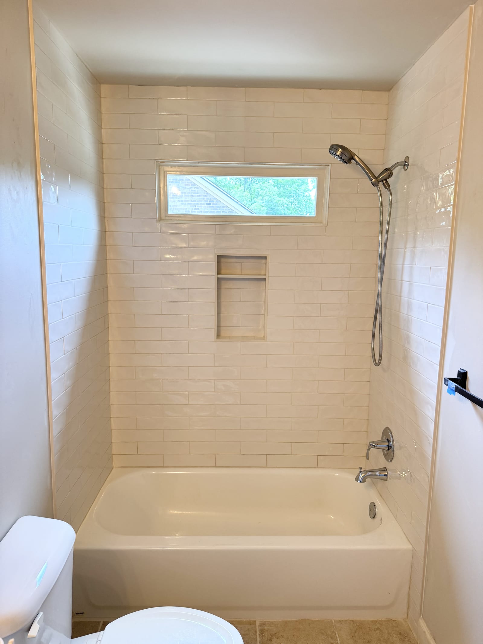 Tub-to-shower conversion with subway tile surround
